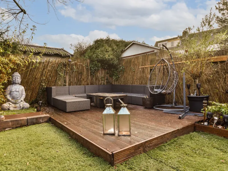 Stylish Backyard Patio with Modern Furniture on a wooden deck